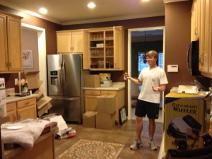 Drew unpacking the kitchen when we first moved